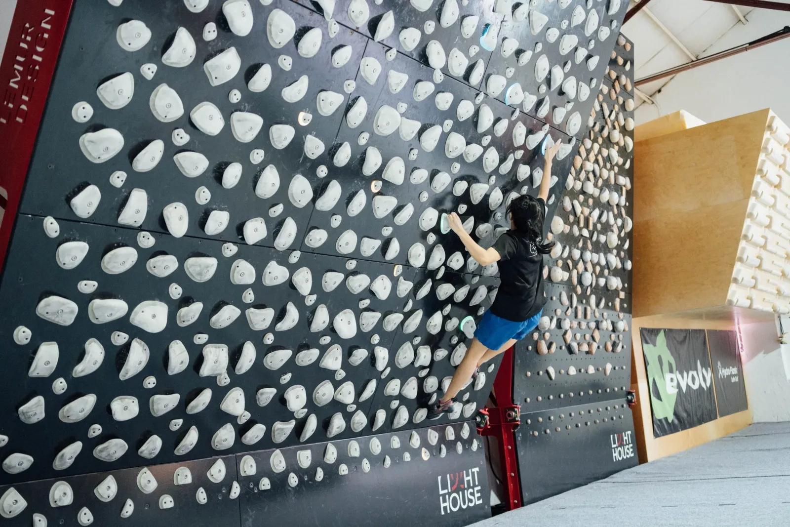 The Kilter Board at Lighthouse Climbing: a steep adjustable panel with large ergonomic holds and LED-lit problems